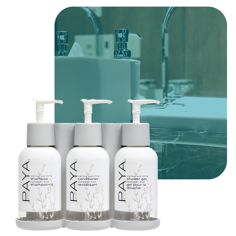 photo of paya three-chamber wall-mounted hotel dispenser set, with individual units for Shower Gel, Shampoo, and Conditioner.