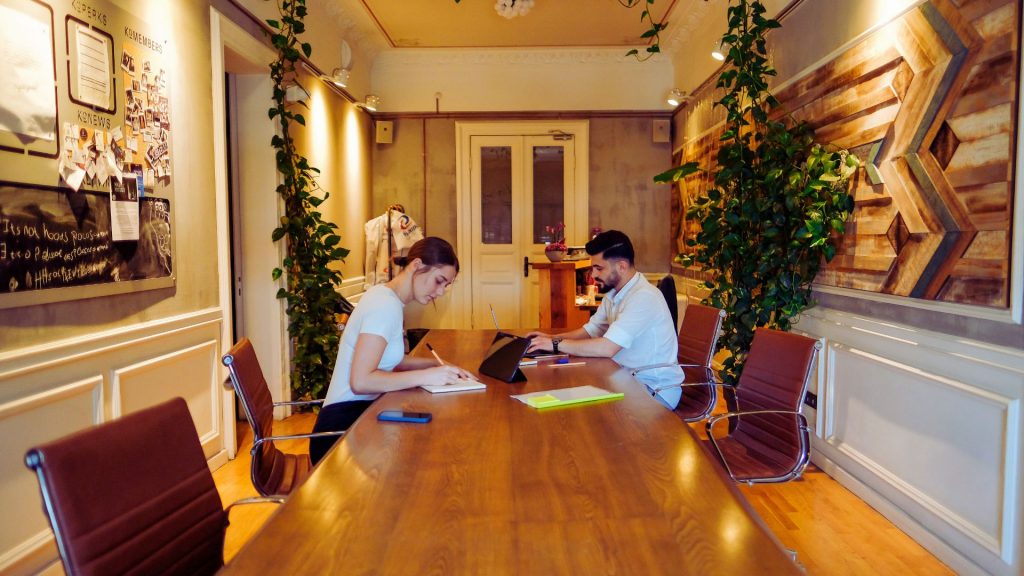 2 hotel people writing